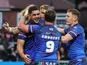 Wakefield Trinity players celebrate a try during a Super League match