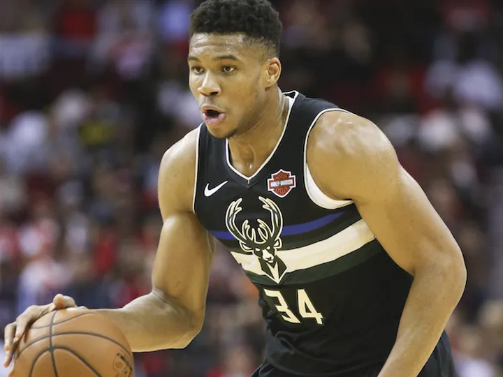 Giannis Antetokounmpo starts season with triple-double as Bucks see off Rockets