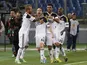 Fener's Caner Erkin celebrates with teammates after scoring a goal Lazio on April 11, 2013