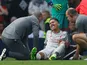 Liverpool's Roberto Firmino goes down injured during the Premier League match with Manchester United on February 24, 2019.