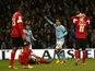 Manchester City's Carlos Tevez celebrates scoring his hat trick in his side's FA Cup match with Barnsley on March 9, 2013