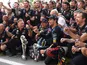 Red Bull's Max Verstappen celebrates winning the race with Red Bull team principal Christian Horner, Red Bull's Sergio Perez and team on September 3, 2023
