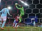 PSV Eindhoven's goalkeeper Jeroen Zoet stops a ball against Atletico Madrid on March 15, 2016
