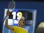 Jarkko Nieminen celebrates defeating Tommy Haas in five-sets at the Australian Open tennis championship on January 15, 2013