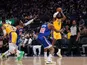Los Angeles Lakers forward LeBron James (6) makes a three point basket over Golden State Warriors forward Andrew Wiggins (22) in the third quarter at the Chase Center. on February 12, 2022