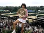 Virginia Wade with the Wimbledon trophy in 1977.
