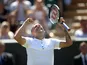 Britain's Dan Evans celebrates after winning his second round match against Georgia's Nikoloz Basilashvili on July 4, 2019