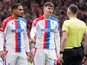 Crystal Palace's Maxence Lacroix and Jorgen Strand Larsen remonstrate with the referee on March 1, 2026
