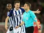 West Bromwich Albion defender Jonny Evans complains to referee Craig Pawson over a VAR decision during his side's FA Cup fourth round clash with Liverpool at Anfield on January 27, 2018