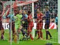 Bayern goalkeeper holds onto the ball after Arsenal's Laurent Koscielny headed in his team's second on March 13, 2013