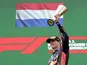 Red Bull's Max Verstappen celebrates with a trophy on the podium after winning the race on July 2, 2023