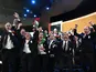 Delegation members representing Milan Cortina celebrate after the city won the bid to host the 2026 Winter Olympic Games during the 134th Session of the International Olympic Committee (IOC), at the SwissTech Convention Centre, in Lausanne, Switzerland Ju