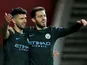 Sergio Aguero celebrates with Bernardo Silva after scoring during the EFL Cup game between Bristol City and Manchester City on January 23, 2018