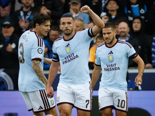 Villa captain McGinn makes history in much-needed Champions League win