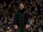 Pep Guardiola watches on during the Premier League game between Manchester City and Manchester United on December 7, 2019