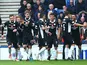 Derek Lyle (R) of Queen of the South celebrates scoring a goal during the first half of the Scottish Championship match between Glasgow Rangers FC and Queen of the South FC at Ibrox Stadium on October 17, 2015