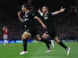Wissam Ben Yedder celebrates scoring with Pablo Sarabia during the Champions League round-of-16 game between Manchester United and Sevilla on March 13, 2018