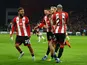 Sheffield United's Oli McBurnie celebrates scoring their first goal with Oliver Norwood, Vini Souza and Jayden Bogle on October 21, 2023