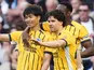 Brighton and Hove Albion's Kaoru Mitoma (left) celebrates scoring their side's first goal  with Ferdi Kadioglu on April 18, 2026