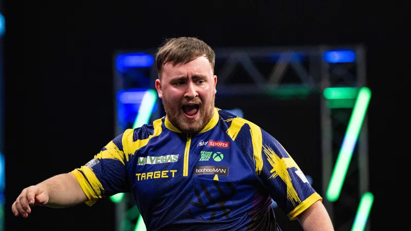 Littler overcomes Humphries in Grand Slam of Darts final to cement world number one status