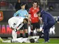 Paris Saint-Germain's (PSG) Nordi Mukiele receives medical attention after sustaining an injury as Neymar and Stade Rennes' Arthur Theate look on on January 15, 2023