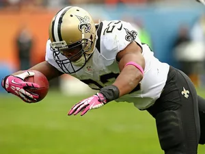 New Orleans Saints' Pierre Thomas dives into the end zone to score a touchdown against the Chicago Bears at Soldier Field on October 6, 2013