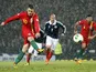 Wales player Aaron Ramsey scores from the penalty spot during his side's World Cup qualifier with Scotland on March 22, 2013