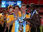 Newport County players celebrate their Blue Square Premier League victory over Wrexham on May 5, 2013
