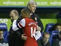 Gunners boss Arsene Wenger hugs goalscorer Theo Walcott as he comes off at Reading on December 17, 2012