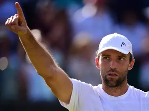 Croatia's Ivo Karlovic celebrates beating France's Jo-Wilfried Tsonga during their men's singles third round match on day six of the 2015 Wimbledon Championships at The All England Tennis Club in Wimbledon, southwest London, on July 4, 2015