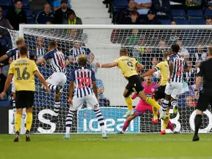 Tom's the toast of his teammates after breaking his Millwall duck