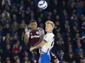 Paul van Hecke and Ezri Konsa challenge for the ball on 2 April 2025