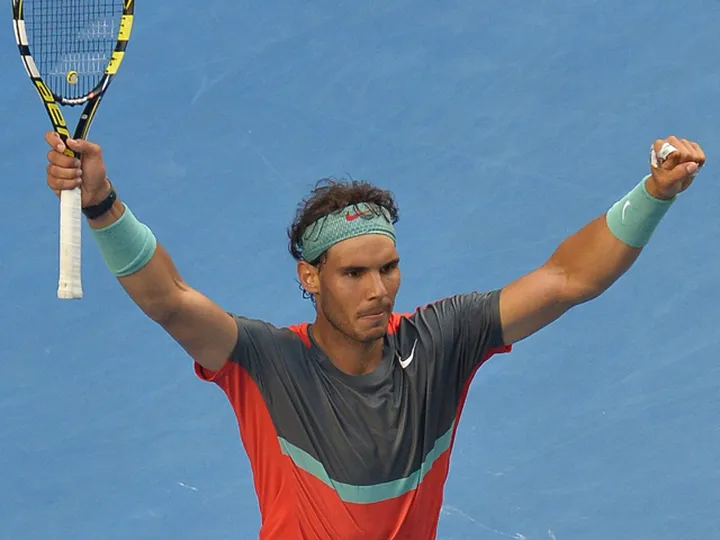 Nadal fights into last eight