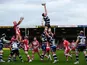 Stuart Hooper of Bath (C) stretches for the line out during the Aviva Premiership match between Gloucester and Bath at Kingsholm Stadium on April 12, 2014