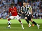 Manchester United's Fred in action with Newcastle United's Sean Longstaff on February 26, 2023