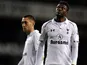Clint Dempsey and Emmanuel Adebayor look downbeat
