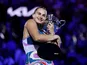 Belarus' Aryna Sabalenka celebrates with the trophy after winning her final match against Kazakhstan's Elena Rybakina on January 28, 2023