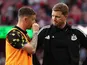 Eddie Howe manager of Newcastle United looks on dejected with Kieran Trippier on April 25, 2026