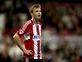 Craig rejoins Millwall from Brentford