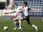 Preston's Alan Browne and Swansea's Jake Bidwell battle for the ball on September 12, 2020