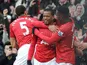 Manchester United defender Patrice Evra celebrates scoring his teams second goal against Liverpool on 13 January, 2013