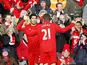 Luis Suarez is congratulated by team mate Lucas after scoring the opener against Spurs on March 10, 2013