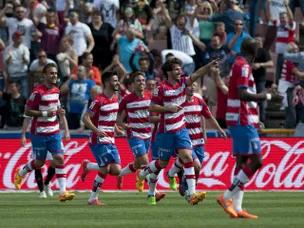 Granada coach hails players after survival