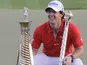 Rory McIlroy with the trophy after winning the final round in the World Tour Championship in Dubai on November 25, 2012