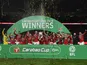 Manchester United players celebrate with the trophy after winning the Carabao Cup on February 26, 2023