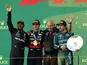 Red Bull's Max Verstappen celebrates on the podium after winning the Australian Grand Prix along with second placed Mercedes' Lewis Hamilton and Aston Martin's Fernando Alonso on April 2, 2023