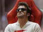 Fernando Alonso sits in his team's pit on November 23, 2012
