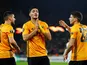 Wolverhampton Wanderers' Raul Jimenez celebrates scoring their first goal with Ruben Neves and Ruben Vinagre on November 7, 2019