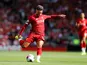 Alex Oxlade-Chamberlain takes a shot during the Premier League game between Liverpool and Newcastle United on September 14, 2019