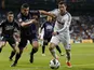 Valladolid's Jesus Rueda vies for the ball with Real Madrid's Cristiano Ronaldo during the La Liga match on May 4, 2013 